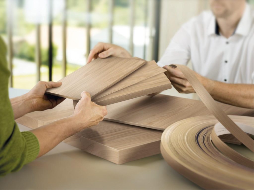 Comparing coordinated woodgrain decorative board samples and matching edging